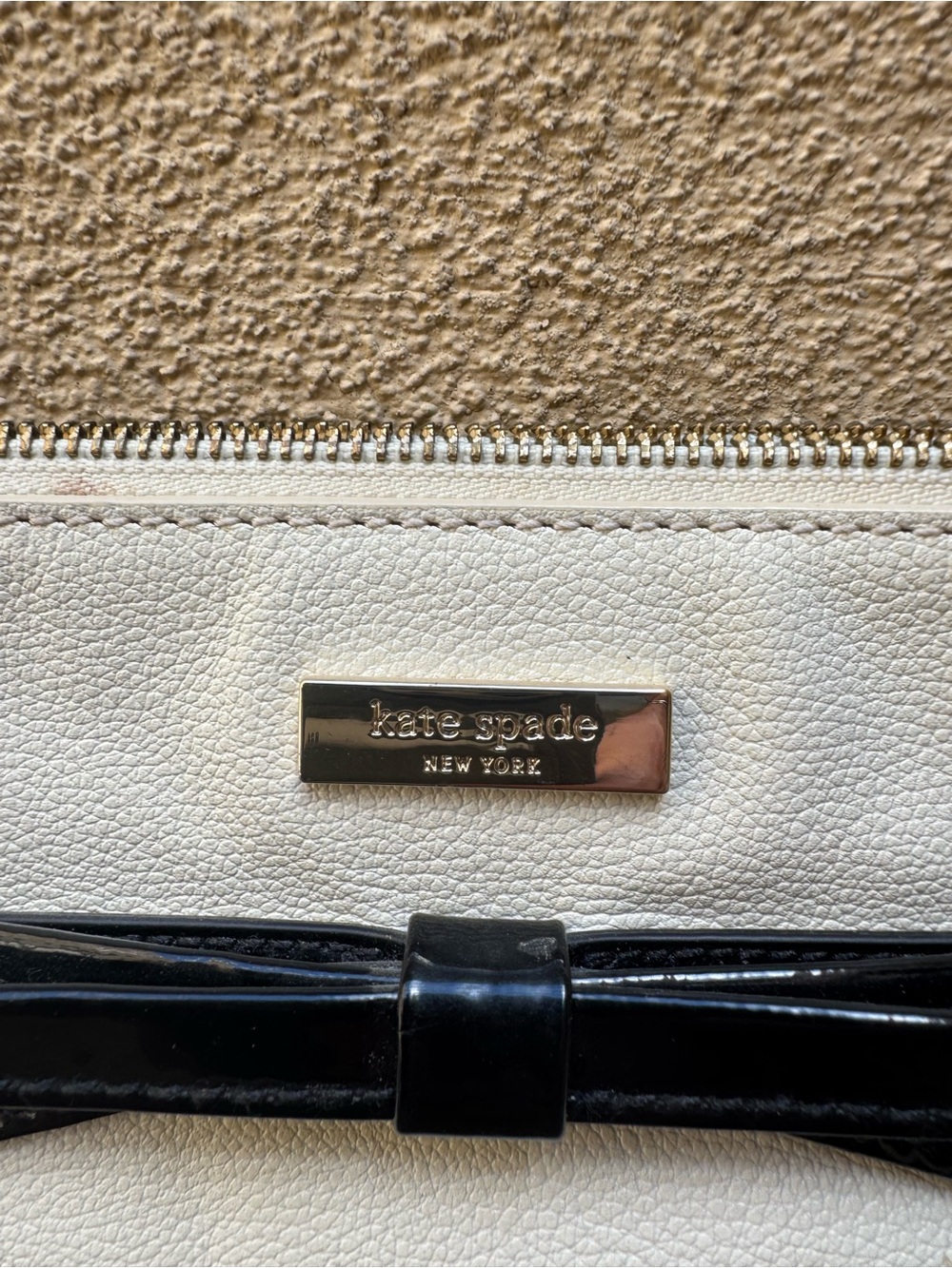 kate spade Cream and Black Leather Bow Clutch with Gold Plate